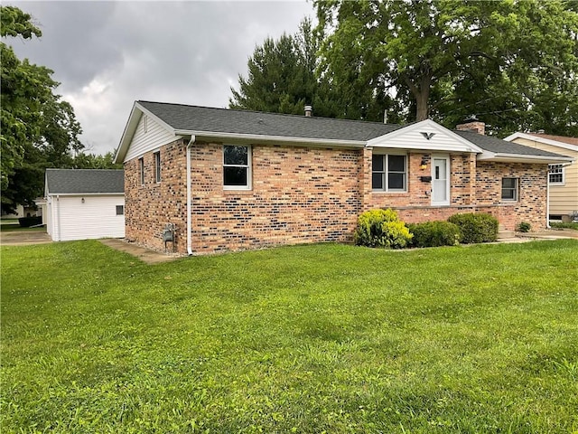 1696 W Evandale Dr, Decatur, IL 62526 - single story home with brick siding, a front yard, and a shingled roof