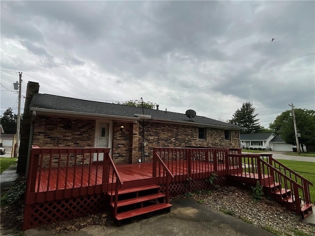 1696 W Evandale Dr, Decatur, IL 62526 - rear view of property with a chimney, a wooden deck, brick siding, and a shingled roof