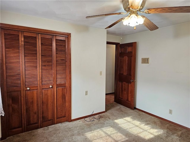 202 E Madison St, Toledo, IL 62468 - unfurnished bedroom with light carpet, a closet, baseboards, and ceiling fan