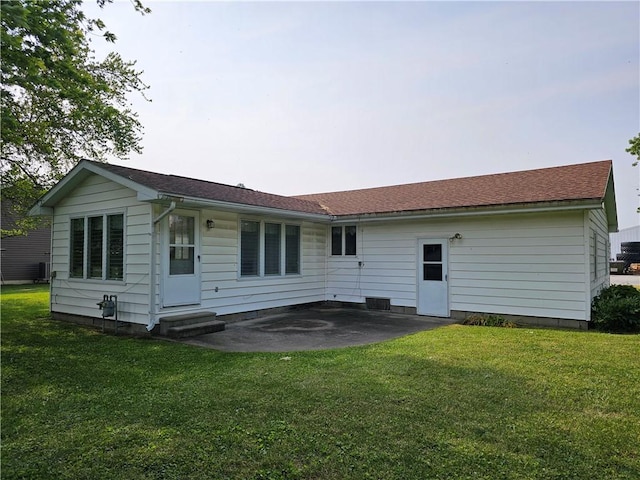 202 E Madison St, Toledo, IL 62468 - back of property featuring a patio, entry steps, a yard, and central AC