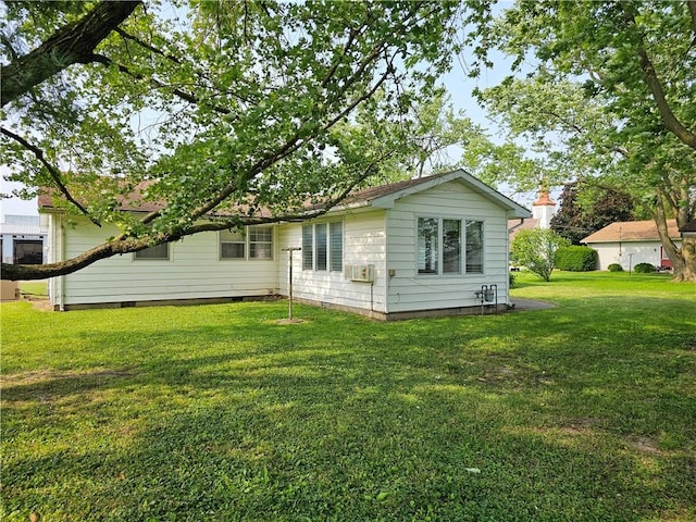 202 E Madison St, Toledo, IL 62468 - back of property featuring crawl space and a lawn