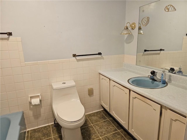202 E Madison St, Toledo, IL 62468 - full bathroom with tile walls, vanity, a tub, toilet, and tile patterned flooring