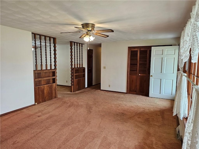 202 E Madison St, Toledo, IL 62468 - empty room with ceiling fan, carpet, and baseboards