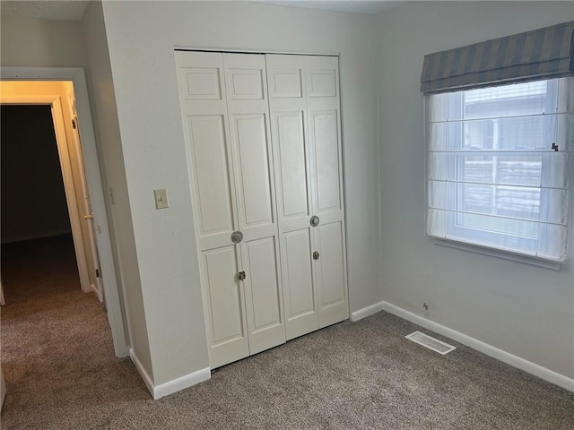 1413 13th St, Charleston, IL 61920 - unfurnished bedroom with carpet floors and a closet