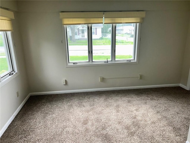 1413 13th St, Charleston, IL 61920 - carpeted empty room with plenty of natural light