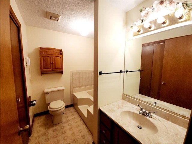 803 S Lafayette St, Newton, IL 62448 - bathroom with vanity, a bath, a textured ceiling, and tile patterned floors