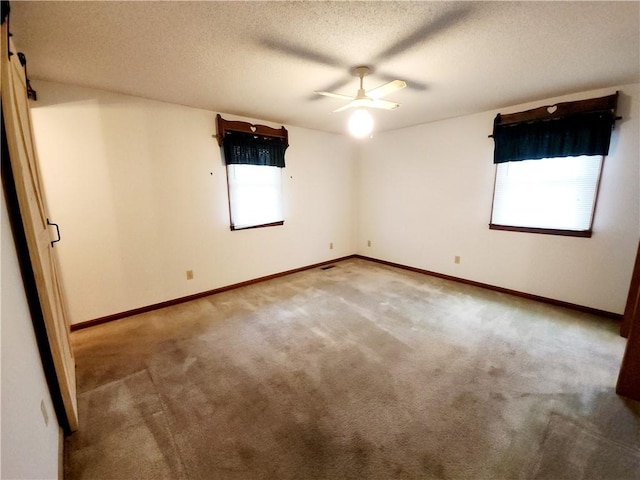 803 S Lafayette St, Newton, IL 62448 - carpeted empty room with a ceiling fan and a textured ceiling