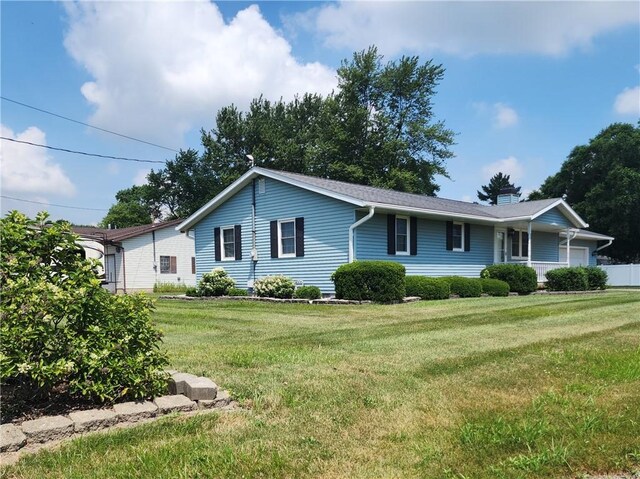803 S Lafayette St, Newton, IL 62448 - single story home featuring a front yard, a garage, and a chimney