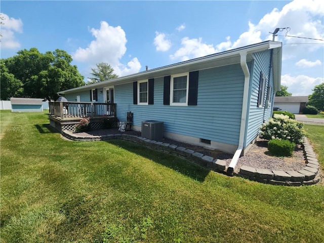803 S Lafayette St, Newton, IL 62448 - back of property featuring a wooden deck, a lawn, and crawl space