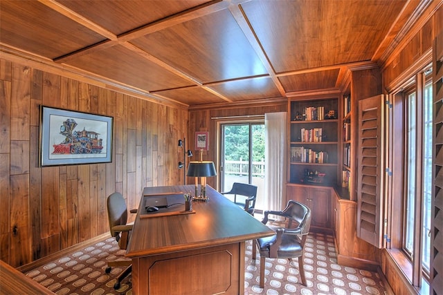 office area with built in shelves, coffered ceiling, wooden walls, and wood ceiling