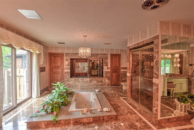 miscellaneous room with a chandelier and a textured ceiling