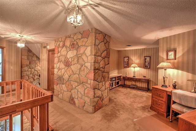 bedroom featuring a textured ceiling, light colored carpet, and vaulted ceiling