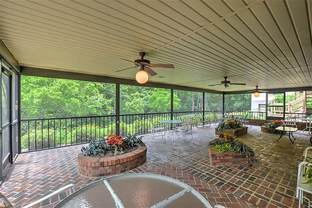 sunroom / solarium with wood ceiling