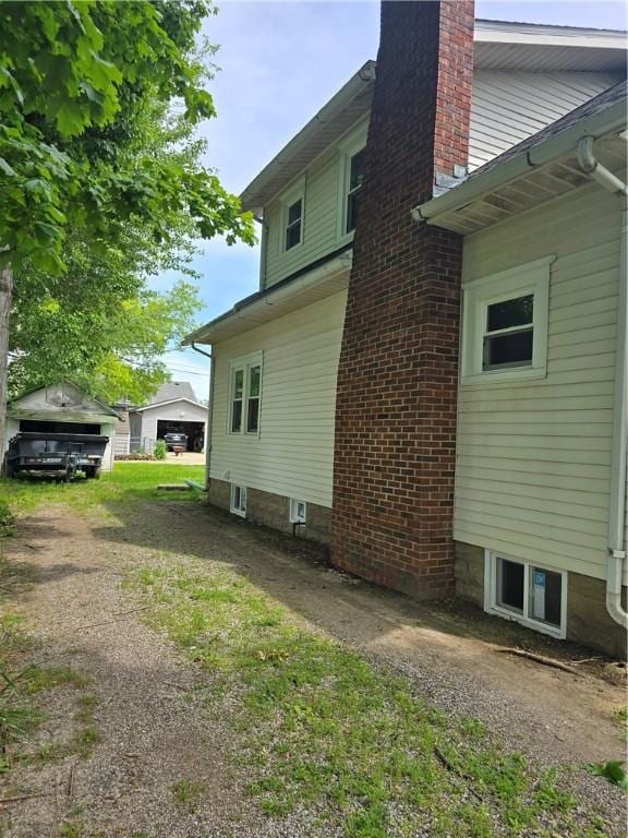 107 S Edwards St, Altamont, IL 62411 - view of side of home featuring a chimney