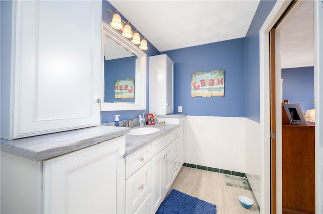 bathroom featuring hardwood / wood-style floors and vanity