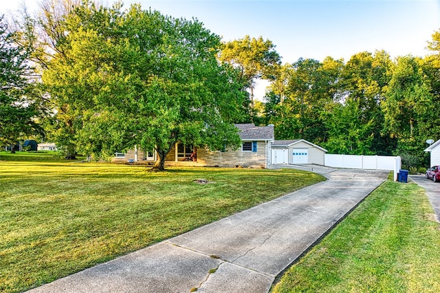 view of front of home with a garage and a front yard