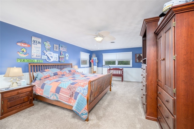 bedroom featuring light carpet and ceiling fan