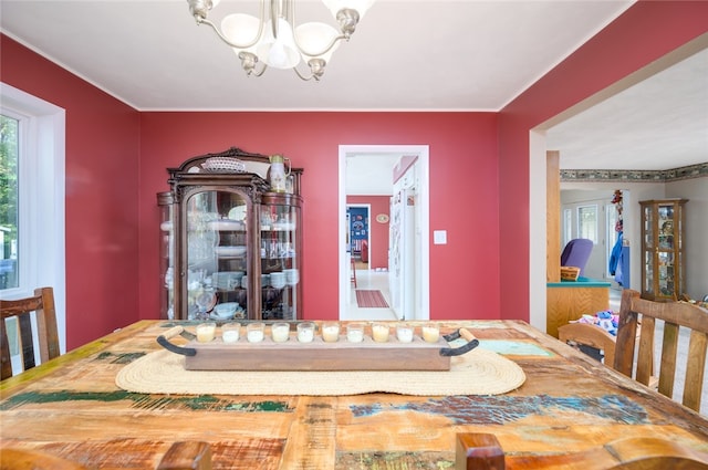 dining space with a notable chandelier