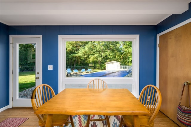 dining space with a wealth of natural light and light hardwood / wood-style flooring