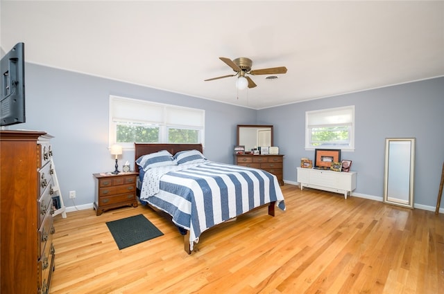 bedroom featuring light wood-type flooring and ceiling fan