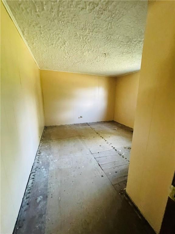 14014 E US Highway 40, Marshall, IL 62441 - spare room featuring a textured ceiling
