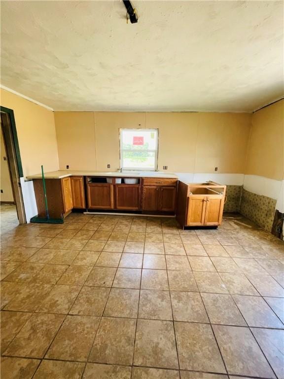 14014 E US Highway 40, Marshall, IL 62441 - kitchen featuring brown cabinetry, light tile patterned floors, and light countertops