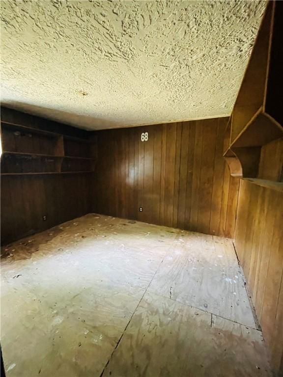 14014 E US Highway 40, Marshall, IL 62441 - spare room featuring wooden walls and a textured ceiling