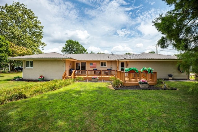101 Willow Dr, Farina, IL 62838 - rear view of property with a metal roof, a wooden deck, and a lawn