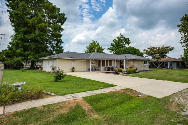 101 Willow Dr, Farina, IL 62838 - ranch-style home with an attached garage, a front lawn, driveway, and a metal roof