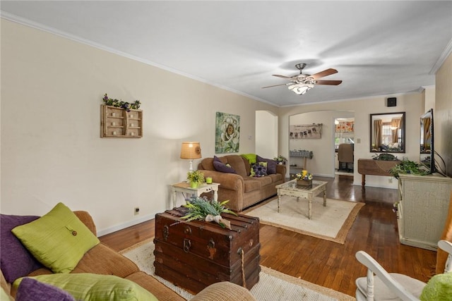 101 Willow Dr, Farina, IL 62838 - living area featuring ornamental molding, arched walkways, a ceiling fan, and wood finished floors