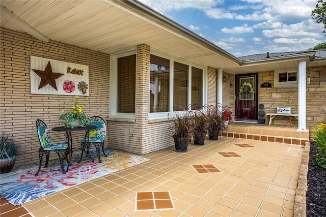 101 Willow Dr, Farina, IL 62838 - view of exterior entry with brick siding and a metal roof