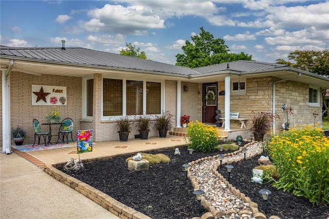 101 Willow Dr, Farina, IL 62838 - view of front facade with a porch, a metal roof, and brick siding