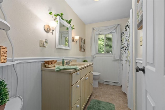 101 Willow Dr, Farina, IL 62838 - full bathroom with baseboard heating, vanity, and a wainscoted wall