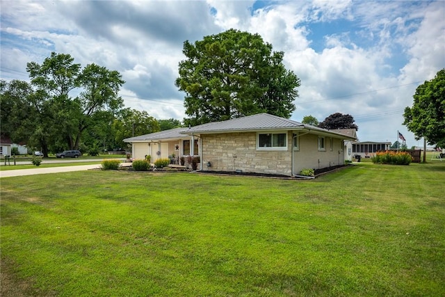 101 Willow Dr, Farina, IL 62838 - view of front of property with stone siding, a front lawn, and a metal roof