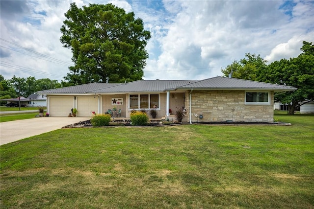 101 Willow Dr, Farina, IL 62838 - ranch-style house with an attached garage, concrete driveway, a metal roof, stone siding, and a front lawn