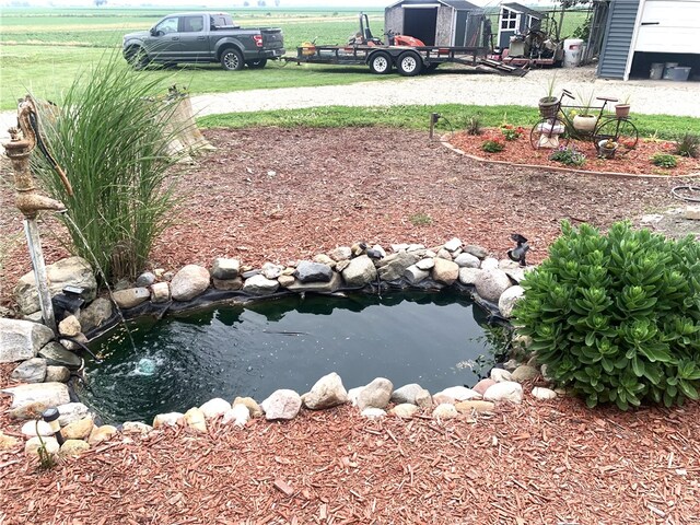647 E 2100 N Rd, Assumption, IL 62510 - view of yard with a storage shed and a small pond
