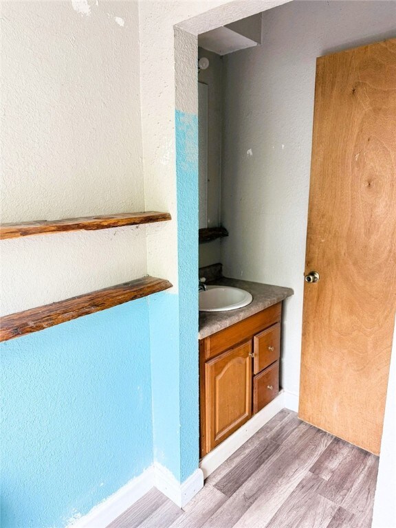 709 10th St, Charleston, IL 61920 - bathroom with wood finished floors and vanity