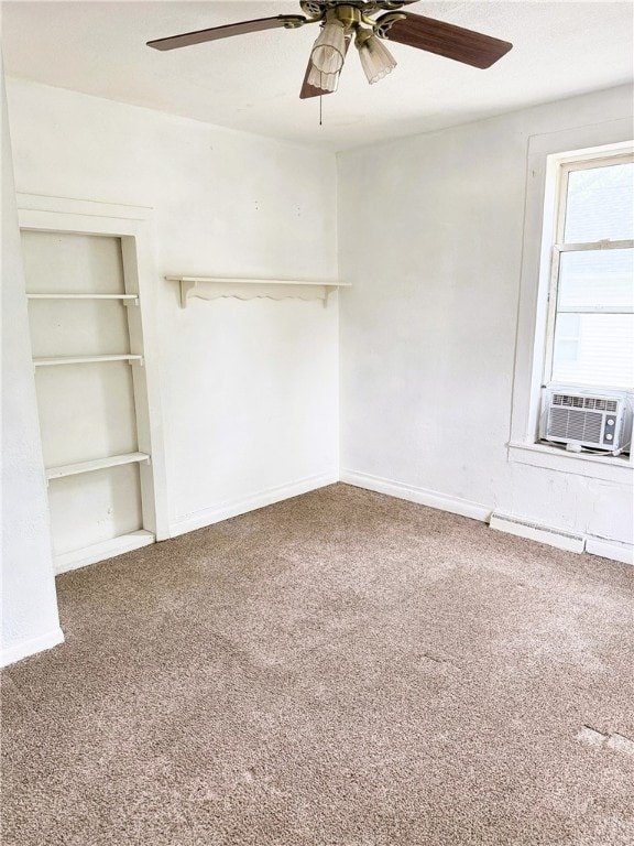 709 10th St, Charleston, IL 61920 - empty room featuring carpet, a ceiling fan, cooling unit, and baseboards