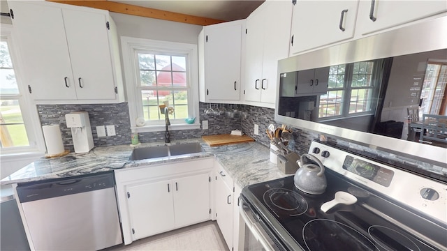 2251 W Stone Bluff Rd, Covington, IN 47932 - kitchen with appliances with stainless steel finishes, tasteful backsplash, light stone counters, white cabinets, and beamed ceiling