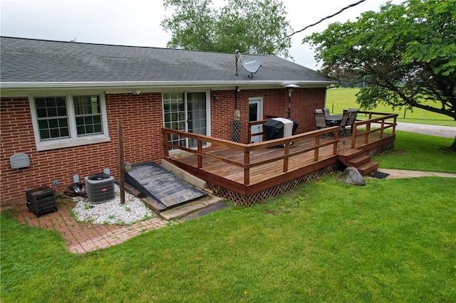 2251 W Stone Bluff Rd, Covington, IN 47932 - back of property featuring a lawn, a deck, brick siding, and roof with shingles