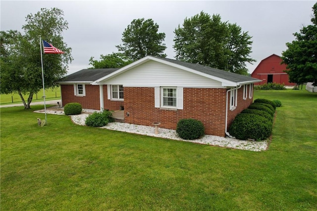 2251 W Stone Bluff Rd, Covington, IN 47932 - back of house featuring a lawn and brick siding