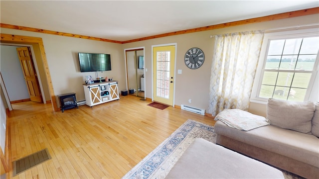 2251 W Stone Bluff Rd, Covington, IN 47932 - living room with a baseboard radiator and light wood-type flooring