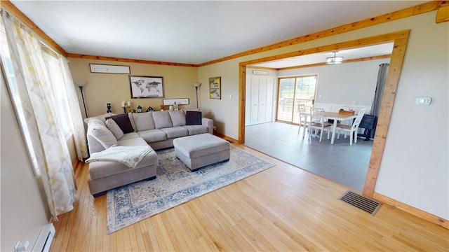 2251 W Stone Bluff Rd, Covington, IN 47932 - living room featuring a baseboard radiator and wood finished floors