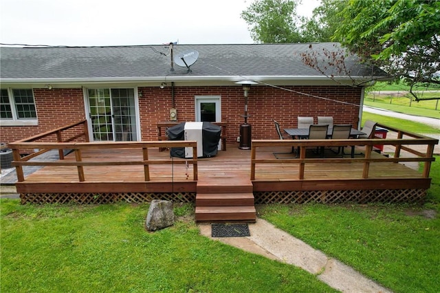 2251 W Stone Bluff Rd, Covington, IN 47932 - back of house with brick siding, a yard, a shingled roof, and outdoor dining space