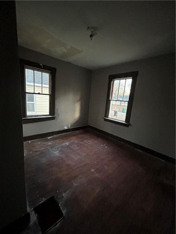 unfurnished room featuring a wealth of natural light