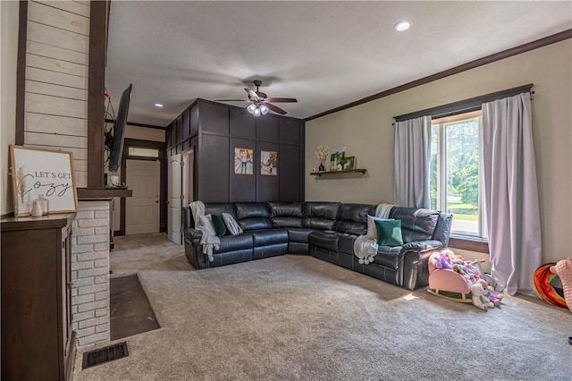 503 W Harrison St, Sullivan, IL 61951 - living room featuring carpet flooring, ceiling fan, and crown molding