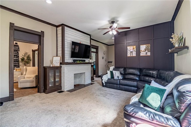 503 W Harrison St, Sullivan, IL 61951 - living area featuring carpet, a ceiling fan, crown molding, and a brick fireplace