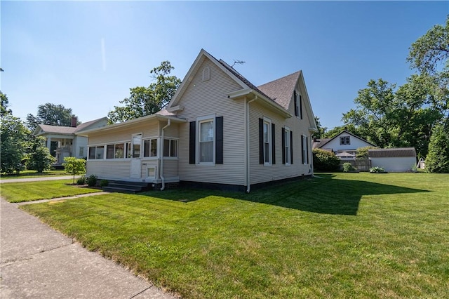 503 W Harrison St, Sullivan, IL 61951 - view of front of home with a front yard and a shed