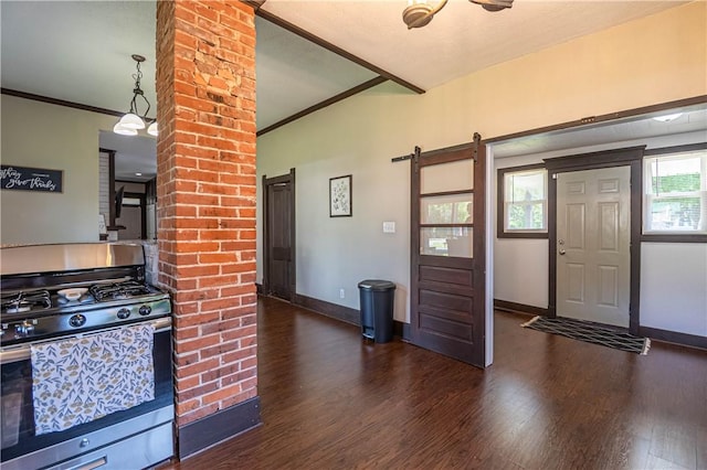503 W Harrison St, Sullivan, IL 61951 - kitchen featuring stainless steel range with gas cooktop, wood finished floors, a barn door, and ornamental molding
