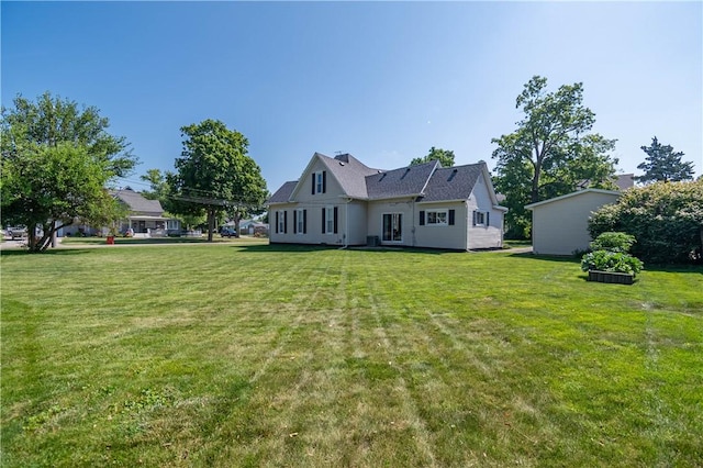 503 W Harrison St, Sullivan, IL 61951 - rear view of property featuring a lawn